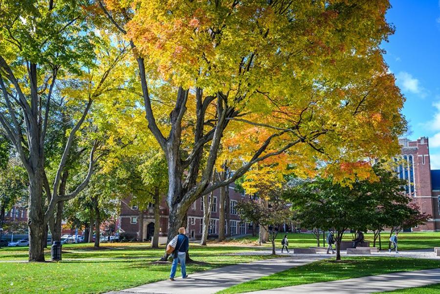 student walking on campus in fall