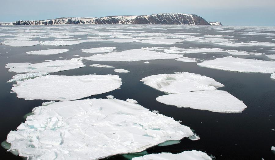 ice bergs floating in water