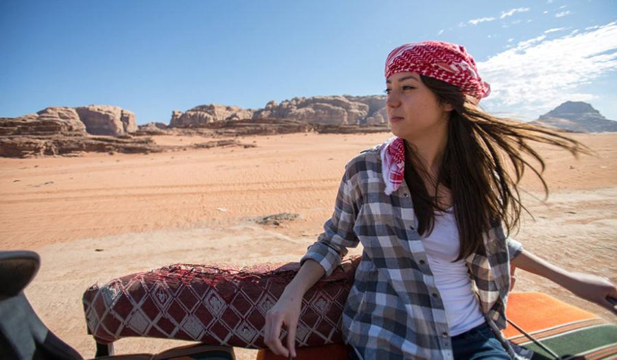 female student looking over desert