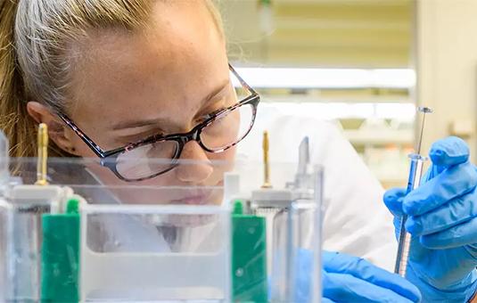 female student in chemistry lab