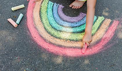 rainbow drawing with chalk on sidewalk